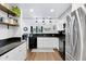 Modern kitchen with white cabinets, granite counters and island at 17642 E Hunt Hwy, Queen Creek, AZ 85142