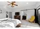 Spacious main bedroom with ensuite bathroom and sliding barn door at 17642 E Hunt Hwy, Queen Creek, AZ 85142