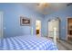 Bedroom with a post bed, featuring a light-blue color scheme and built-in wardrobe at 17721 N Canal Dr, Surprise, AZ 85374