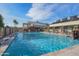 Large community pool with surrounding lounge chairs at 17721 N Canal Dr, Surprise, AZ 85374