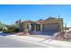 Single-story home with desert landscaping and a two-car garage at 17721 N Canal Dr, Surprise, AZ 85374