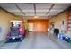 Garage with golf cart, storage shelving and ample space at 17721 N Canal Dr, Surprise, AZ 85374