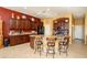 Bright kitchen with granite island and dark wood cabinets at 17721 N Canal Dr, Surprise, AZ 85374