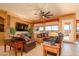 Spacious living room with leather sofas and large windows at 17721 N Canal Dr, Surprise, AZ 85374