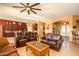 Living room with leather furniture and a view of the kitchen at 17721 N Canal Dr, Surprise, AZ 85374