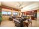 Open living room with a view of the kitchen and entry at 17721 N Canal Dr, Surprise, AZ 85374