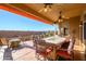 Outdoor patio with seating area, fire pit, and built-in BBQ at 17721 N Canal Dr, Surprise, AZ 85374