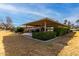 Covered patio, grassy area, and mature shrubs at 17811 N Boswell Blvd, Sun City, AZ 85373