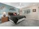 Guest bedroom with queen-size bed and ceiling fan at 17811 N Boswell Blvd, Sun City, AZ 85373