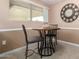 Cozy breakfast nook with a round table and two chairs at 17811 N Boswell Blvd, Sun City, AZ 85373