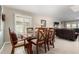 Bright dining area with a glass-top table and wooden chairs at 17811 N Boswell Blvd, Sun City, AZ 85373