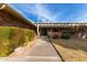 Front entrance with walkway and lush landscaping at 17811 N Boswell Blvd, Sun City, AZ 85373