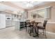 Kitchen with an island, gray cabinets, and breakfast nook at 17811 N Boswell Blvd, Sun City, AZ 85373