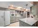 Modern kitchen featuring updated gray cabinets, ample counter space, and stainless steel appliances at 17811 N Boswell Blvd, Sun City, AZ 85373