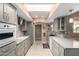 Open kitchen with ample counter space and gray cabinetry at 17811 N Boswell Blvd, Sun City, AZ 85373