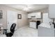 Laundry room with sink, cabinets and desk at 17811 N Boswell Blvd, Sun City, AZ 85373