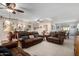 Spacious living room with leather furniture and tile floors at 17811 N Boswell Blvd, Sun City, AZ 85373