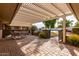 Covered patio with brick flooring and outdoor seating at 17811 N Boswell Blvd, Sun City, AZ 85373