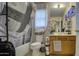 Bathroom with shower/tub, toilet and wood vanity at 1826 S 363Rd Ave, Tonopah, AZ 85354