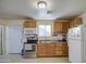 Kitchen with wood cabinets, stainless steel appliances, and a microwave at 1826 S 363Rd Ave, Tonopah, AZ 85354