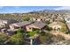 Aerial view of house and neighborhood with mountain backdrop at 18311 E San Ignacio Ct, Gold Canyon, AZ 85118