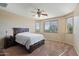 Well-lit bedroom with ceiling fan and large windows offering natural light at 18311 E San Ignacio Ct, Gold Canyon, AZ 85118