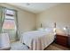 Cozy bedroom with a window and neutral-toned decor at 18311 E San Ignacio Ct, Gold Canyon, AZ 85118