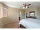 Comfortable bedroom with ensuite bathroom access and large windows at 18311 E San Ignacio Ct, Gold Canyon, AZ 85118