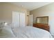 Serene bedroom with double door closet and mirrored dresser at 18311 E San Ignacio Ct, Gold Canyon, AZ 85118