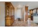 Bright entryway with a wooden china cabinet and tile flooring at 18311 E San Ignacio Ct, Gold Canyon, AZ 85118