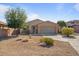 Single-story house with desert landscaping and two-car garage at 18311 E San Ignacio Ct, Gold Canyon, AZ 85118