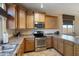 Modern kitchen with stainless steel appliances and ample counter space at 18311 E San Ignacio Ct, Gold Canyon, AZ 85118