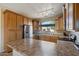 Modern kitchen with stainless steel appliances and wood cabinetry at 18311 E San Ignacio Ct, Gold Canyon, AZ 85118