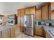 Kitchen features stainless steel appliances and wood cabinets at 18311 E San Ignacio Ct, Gold Canyon, AZ 85118