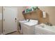 Convenient laundry room with washer, dryer, and utility sink at 18311 E San Ignacio Ct, Gold Canyon, AZ 85118