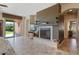 Spacious living room featuring a fireplace and access to a backyard patio at 18311 E San Ignacio Ct, Gold Canyon, AZ 85118