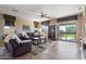 Comfortable living room with leather seating and a view of the backyard at 18311 E San Ignacio Ct, Gold Canyon, AZ 85118