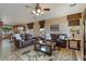 Spacious living room with brown leather furniture and a large area rug at 18311 E San Ignacio Ct, Gold Canyon, AZ 85118