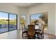 Charming breakfast nook with a round table and view of the desert landscape at 18702 E Gemmill Dr, Rio Verde, AZ 85263