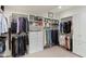 Custom closet with ample hanging space and shelving at 18702 E Gemmill Dr, Rio Verde, AZ 85263