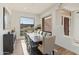 Elegant dining room with large windows and seating for eight at 18702 E Gemmill Dr, Rio Verde, AZ 85263