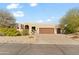 Stunning desert home with a large front yard, two-car garage, and attractive landscaping at 18702 E Gemmill Dr, Rio Verde, AZ 85263