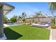 Inviting backyard with a refreshing pool and lush grass at 1918 W Bonanza Ln, Phoenix, AZ 85085