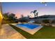 Beautiful backyard with pool and patio area during sunset at 1918 W Bonanza Ln, Phoenix, AZ 85085