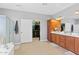 Bright bathroom with double vanity, walk-in shower, and large closet at 1918 W Bonanza Ln, Phoenix, AZ 85085