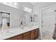 Bathroom with double vanity, large mirror, and separate shower at 1918 W Bonanza Ln, Phoenix, AZ 85085