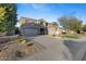 Two-story house with gray exterior, landscaped yard, and a three-car garage at 1918 W Bonanza Ln, Phoenix, AZ 85085