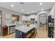 Spacious kitchen with island, white cabinets, and breakfast bar at 1918 W Bonanza Ln, Phoenix, AZ 85085