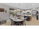 Kitchen with island, white cabinets, and view of backyard and pool at 1918 W Bonanza Ln, Phoenix, AZ 85085