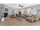 Living room featuring a stone fireplace and large windows at 1918 W Bonanza Ln, Phoenix, AZ 85085